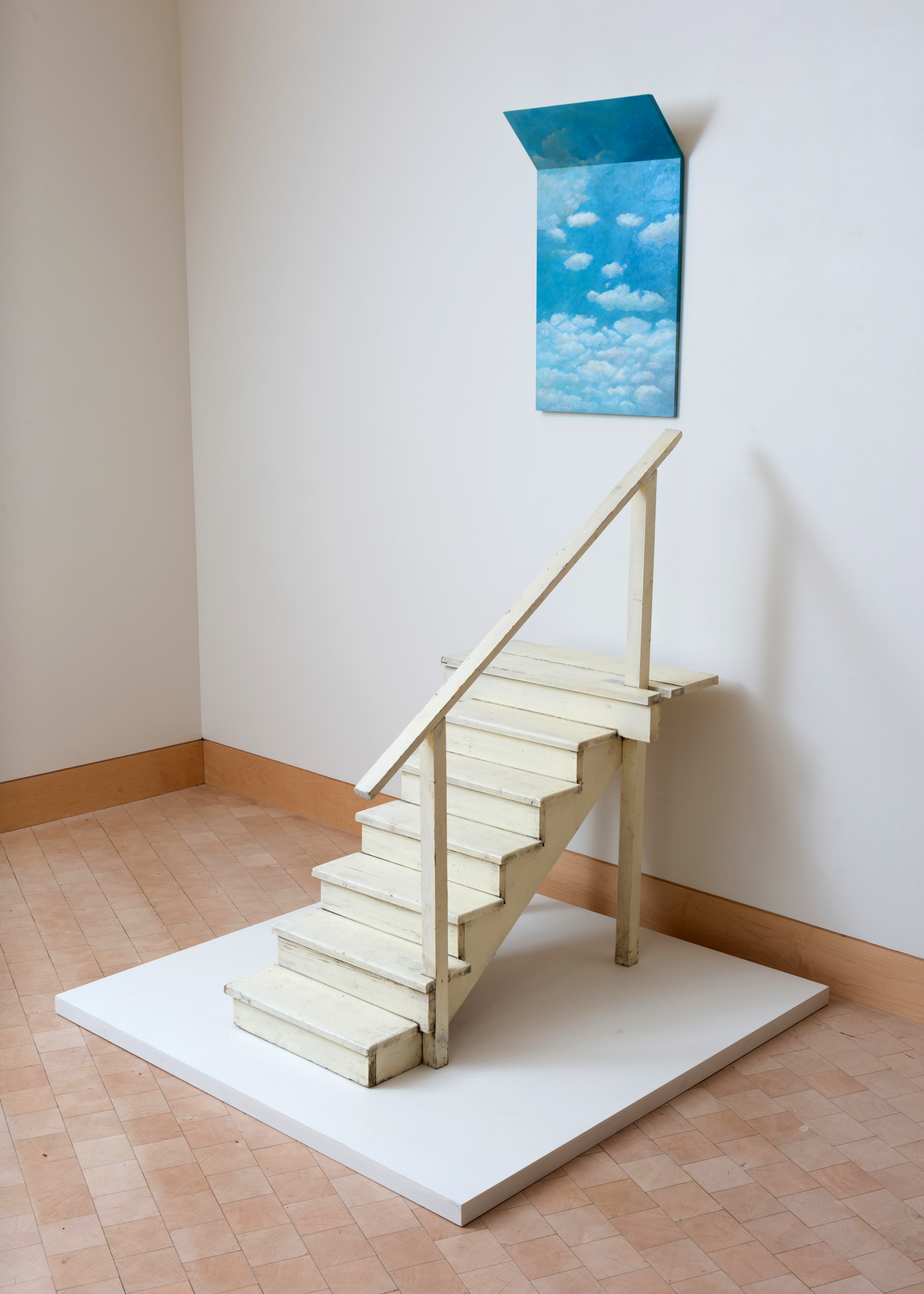 stairs leading to painting of clouds and sky