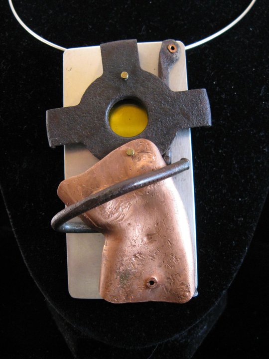 pendant made of mixed metals in different shapes