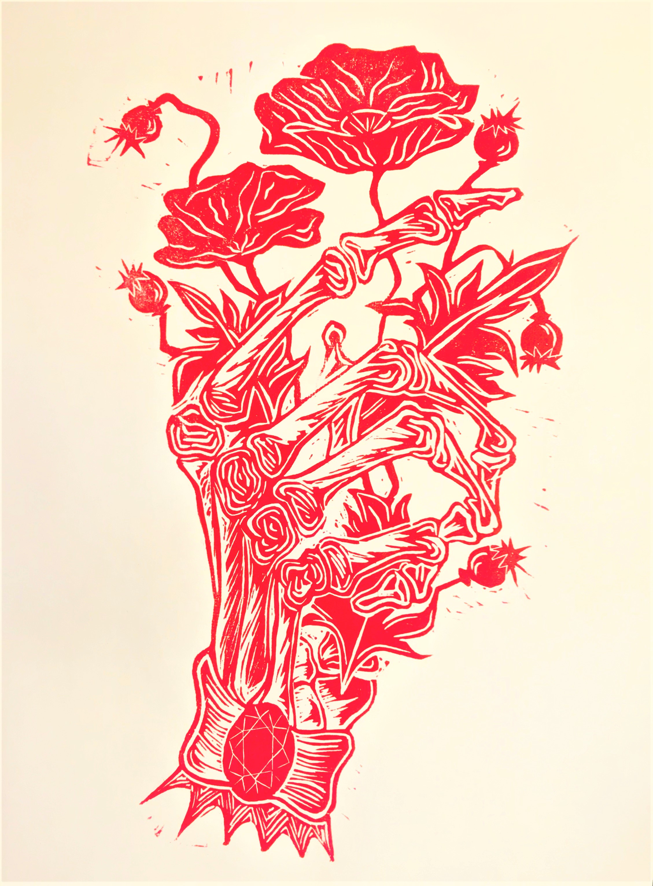 print of skeletal hand holding flowers