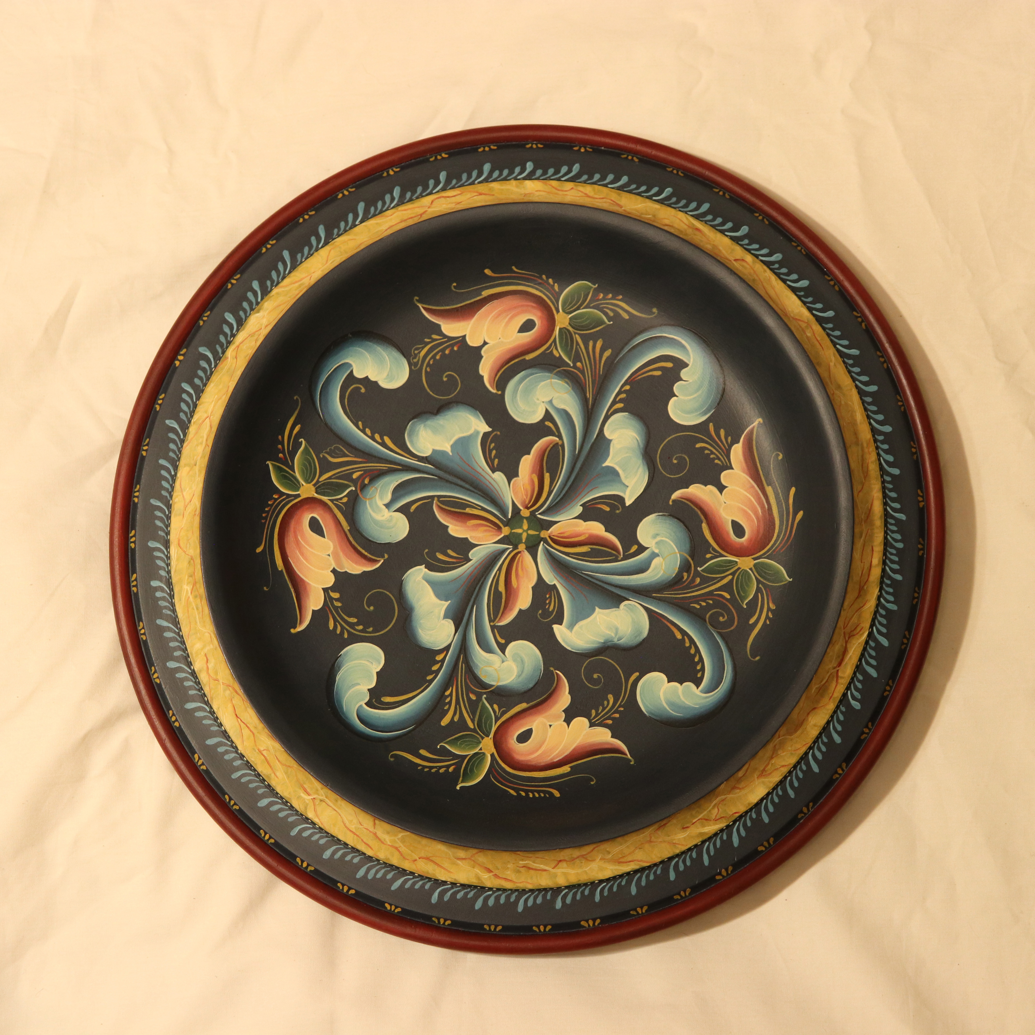 shallow bowl with rosemaling painting with blue and orange acanthus leaves (gudbrandsdal style)