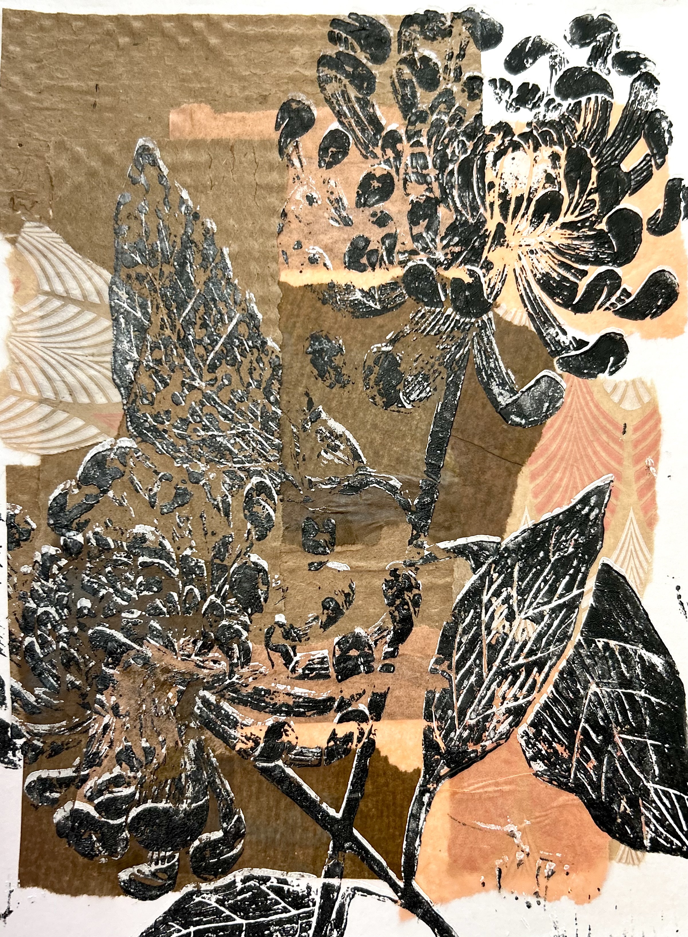 Black woodcut prints of chrysanthemums on tan, brown, peach colored pieces of patterned paper
