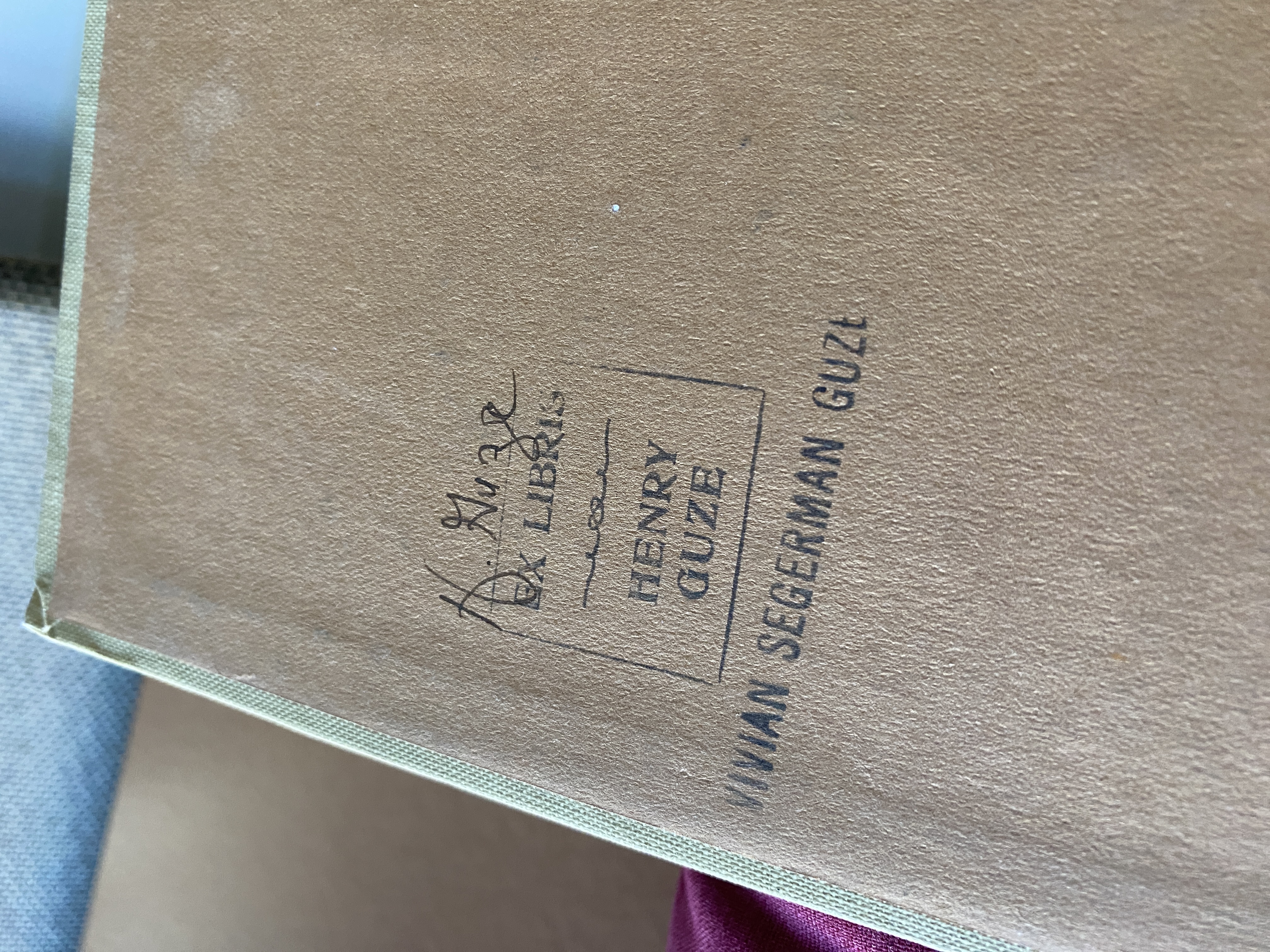 Close up of ink Ex Libris stamp from Henry Guze with signature inscribed, and
